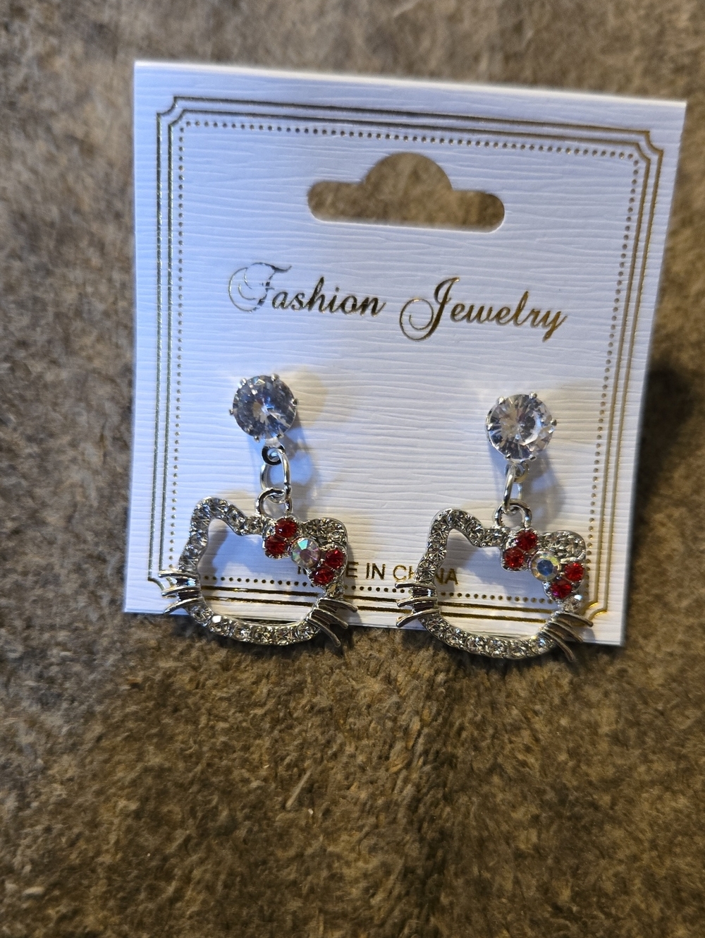 3/$10 Bundle Deals Silver Toned HK Outline Drop Earrings with Red Accents